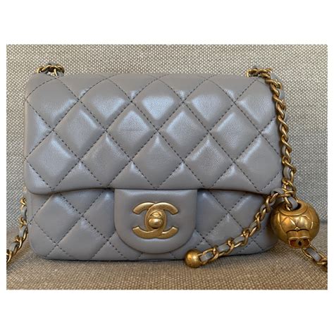 light grey chanel bag.